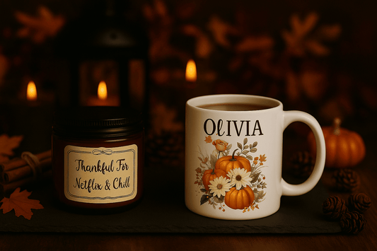 Personalized autumn mug with name Olivia and pumpkin floral design next to Thankful For Netflix & Chill custom scented candle on rustic wooden table with fall leaves and warm lighting