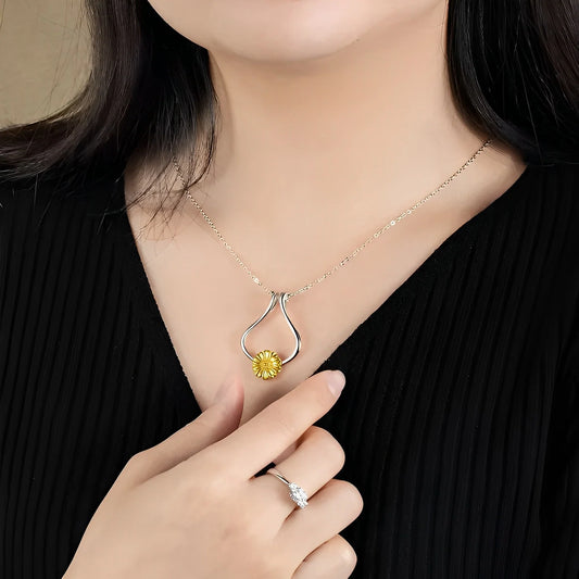 Woman wearing personalized jewelry necklace with flower pendant and ring - custom jewelry gifts that avoid common jewelry gift mistakes from Bella Olivia Gifts