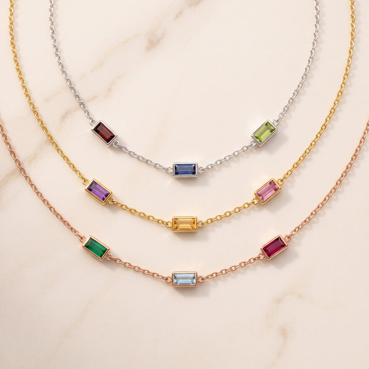 Personalized Square Birthstones Necklace, flat lay in silver, gold and rose gold, a different birthstone on each