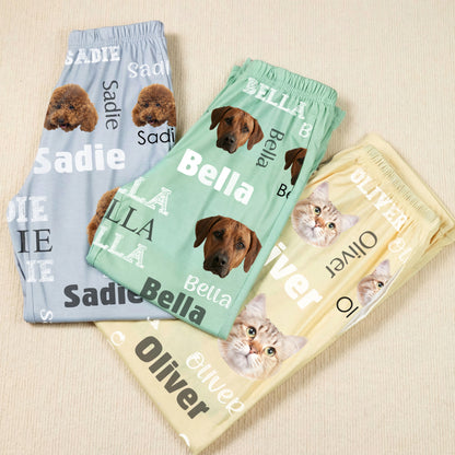 Personalized pet face pajama pants folded in blue, green and yellow