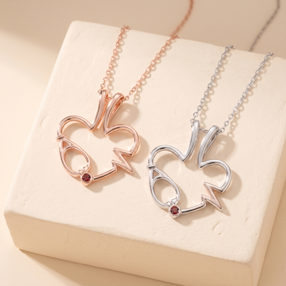 Collana portanelli con stetoscopio e pietra portafortuna