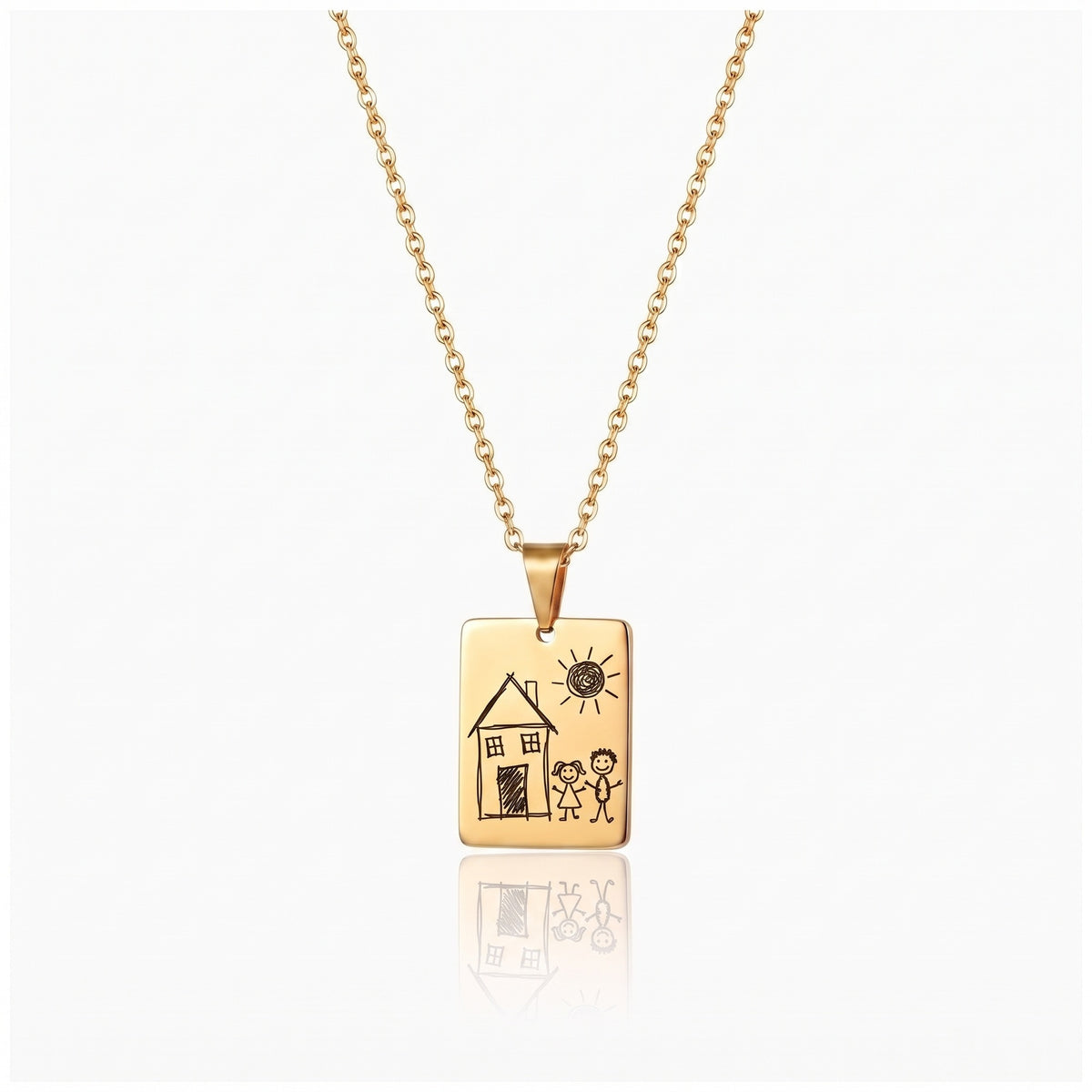 Gold kids drawing necklace engraved with a toddler drawing of a house, the sun and two stick figures