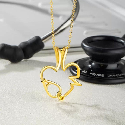 Collana portanelli con stetoscopio e pietra portafortuna